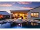 Gorgeous backyard with a luxurious pool and relaxing fire pit, perfect for outdoor entertaining at 2535 E Thornton Ct, Gilbert, AZ 85297