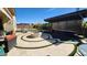 Relaxing backyard oasis with a custom pool, pergola, and fire pit at 2535 E Thornton Ct, Gilbert, AZ 85297