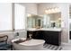 Elegant bathroom features a standalone tub with a soaking tray and stylish decor, and a dual sink vanity at 2535 E Thornton Ct, Gilbert, AZ 85297