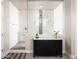 Modern bathroom showcasing a large, glass-enclosed shower with white subway tile and a stylish vanity at 2535 E Thornton Ct, Gilbert, AZ 85297