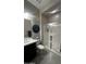 Modern bathroom featuring a sleek vanity, updated toilet, and glass-enclosed shower with stylish tile work at 2535 E Thornton Ct, Gilbert, AZ 85297