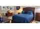 Comfortable bedroom with a queen bed, plush pillows, and stylish decor at 2535 E Thornton Ct, Gilbert, AZ 85297