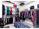 Walk-in closet with organized shelving and hanging space for clothes and accessories, plus a bench at 2535 E Thornton Ct, Gilbert, AZ 85297