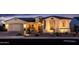 Charming single-story home with desert landscaping and inviting front porch with ample lighting at 2535 E Thornton Ct, Gilbert, AZ 85297