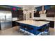 Modern kitchen with a large island, stainless appliances, and pendant lighting at 2535 E Thornton Ct, Gilbert, AZ 85297