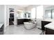 A modern bathroom features a standalone tub, dark wood cabinets, and a walk-in closet at 2535 E Thornton Ct, Gilbert, AZ 85297