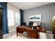 A well-appointed home office features a classic desk, comfortable chair, and tasteful decorative accents at 2535 E Thornton Ct, Gilbert, AZ 85297