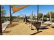 Community playground with climbing structures, swings, and shade, perfect for outdoor fun at 2535 E Thornton Ct, Gilbert, AZ 85297