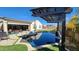 Stunning pool and patio area with a built in pergola and lush landscaping at 2535 E Thornton Ct, Gilbert, AZ 85297
