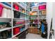 Spacious storage area with neat shelves filled with bins, boxes, and household items for organization at 2535 E Thornton Ct, Gilbert, AZ 85297