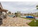 Waterfront backyard with a tiled deck, pool, patio and lounge furniture at 3121 N Meadow Dr, Avondale, AZ 85392