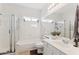 Bright bathroom featuring a shower, tub, vanity, and a large mirror at 3121 N Meadow Dr, Avondale, AZ 85392