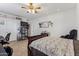 Bright bedroom with a ceiling fan, tiled flooring, and relaxing colors at 3121 N Meadow Dr, Avondale, AZ 85392