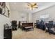 Bedroom featuring a ceiling fan, tiled flooring, and space for work and relaxation at 3121 N Meadow Dr, Avondale, AZ 85392