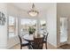 Cozy breakfast nook with a round table, chairs, and views of the lake at 3121 N Meadow Dr, Avondale, AZ 85392
