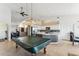 Open floor plan featuring a game area, kitchen, and living space for modern living at 3121 N Meadow Dr, Avondale, AZ 85392