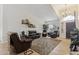 Inviting living room with comfortable leather seating and stylish decor on shelving at 3121 N Meadow Dr, Avondale, AZ 85392