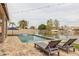 Relaxing poolside view with lounge chairs, perfect for enjoying the waterfront scenery at 3121 N Meadow Dr, Avondale, AZ 85392