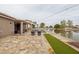 Inviting backyard pool and patio with waterfront views, ideal for relaxation and outdoor entertaining at 3121 N Meadow Dr, Avondale, AZ 85392