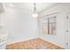 Bright dining area with a window, neutral walls, and hanging light fixture at 3150 E Beardsley Rd # 1038, Phoenix, AZ 85050