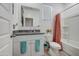 Bright bathroom with granite countertop, white cabinetry, and coordinated towel accents at 3353 W Shanley Ave, Apache Junction, AZ 85120