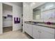 Bright bathroom with double sinks, granite countertops, and modern fixtures at 3353 W Shanley Ave, Apache Junction, AZ 85120