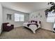 Cozy bedroom with a plush armchair, carpet floors, and stylish decor at 3353 W Shanley Ave, Apache Junction, AZ 85120