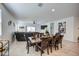 Elegant dining room with a large table, seating for eight, and stylish decor at 3353 W Shanley Ave, Apache Junction, AZ 85120