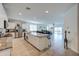 Open kitchen with granite counters, stainless appliances, island with seating, and tile floors at 3353 W Shanley Ave, Apache Junction, AZ 85120