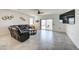 Inviting living room features a large sofa, ceiling fan, and sliding glass doors at 3353 W Shanley Ave, Apache Junction, AZ 85120