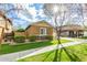 Inviting single-story home with desert landscaping, lush green lawn, and a sunlit yard at 3567 E Sierra Madre Ave, Gilbert, AZ 85296