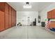 Spacious garage with built-in storage cabinets, ample space for parking and storage at 3567 E Sierra Madre Ave, Gilbert, AZ 85296