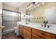 Bathroom with double sinks, tile floors and walk in shower at 38408 N 23Rd Dr, Phoenix, AZ 85086