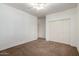 Spacious bedroom featuring neutral carpet, closet and ceiling fan at 38408 N 23Rd Dr, Phoenix, AZ 85086