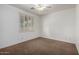 Bedroom with ceiling fan and window with shutters at 38408 N 23Rd Dr, Phoenix, AZ 85086