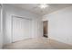 Bright bedroom featuring neutral carpet, closet and ceiling fan at 38408 N 23Rd Dr, Phoenix, AZ 85086