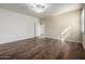 Neutral painted bedroom with wood-look floors, ceiling fan, window with shutters and a standard closet at 38408 N 23Rd Dr, Phoenix, AZ 85086