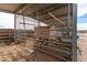 Close up of metal framed chicken coop featuring wire mesh and a wooden hen house at 38408 N 23Rd Dr, Phoenix, AZ 85086