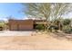 Home exterior showcasing a three-car garage, desert landscaping, and a well-maintained facade at 38408 N 23Rd Dr, Phoenix, AZ 85086