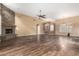 Spacious living room featuring hardwood floors, a fireplace, and open layout at 38408 N 23Rd Dr, Phoenix, AZ 85086