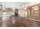 Spacious living room boasts hardwood floors, fireplace, and sliding glass doors at 38408 N 23Rd Dr, Phoenix, AZ 85086