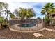 Backyard fenced pool featuring rock surroundings, perfect for Gathering enjoyment and relaxation at 38408 N 23Rd Dr, Phoenix, AZ 85086