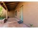 Inviting covered front porch featuring a stylish front door, and terracotta tile flooring at 38408 N 23Rd Dr, Phoenix, AZ 85086