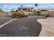 Spacious backyard features desert landscaping with brick accents at 4102 E Morrow Dr, Phoenix, AZ 85050