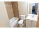 Updated bathroom features tiled shower, new vanity, and decorative flooring at 4110 W Cholla St, Phoenix, AZ 85029