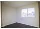 Simple bedroom with natural light from the window and hardwood flooring at 4110 W Cholla St, Phoenix, AZ 85029