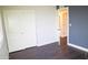 This bedroom includes a closet for storage and hardwood floors throughout the room at 4110 W Cholla St, Phoenix, AZ 85029