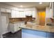 Bright kitchen features white cabinets, granite countertops, and stainless steel appliances at 4110 W Cholla St, Phoenix, AZ 85029