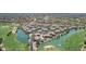 Scenic aerial view of homes nestled along a golf course and lake at 4252 E Desert Sky Ct, Cave Creek, AZ 85331