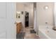 Bathroom featuring a soaking tub, tiled floors and a glimpse into a walk-in closet at 4252 E Desert Sky Ct, Cave Creek, AZ 85331